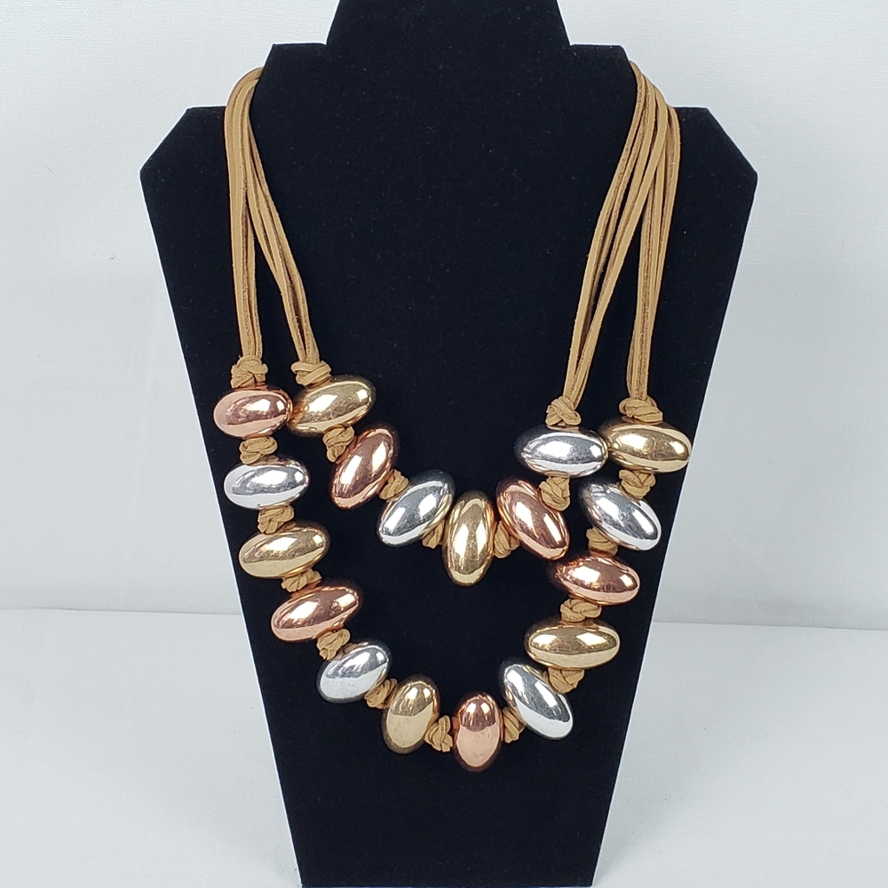 Statement necklace of gold, copper, silver tones